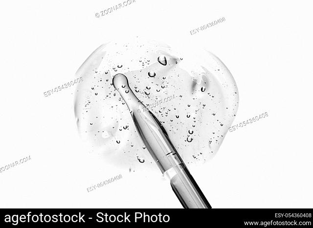 Cream gel transparent cosmetic sample texture with bubbles isolated on white background. Cosmetic cream transparent gel serum texture with micro bubble on white...
