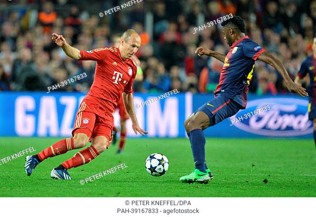 Barcelona's Alex Song (R) and Munich's Arjen Robben vie for the ball during the UEFA Champions League semi final second leg soccer match between FC Barcelona...