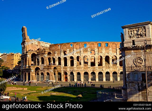 landscape photo of the roman colosseum and constantines arch