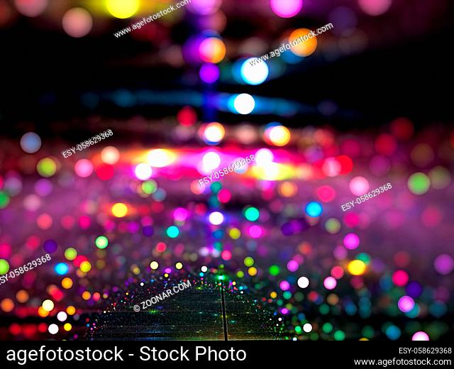 Colourful festive blurred background - abstract computer-generated image. Bright picture with color bokeh. Backdrop for web design, cards, posters