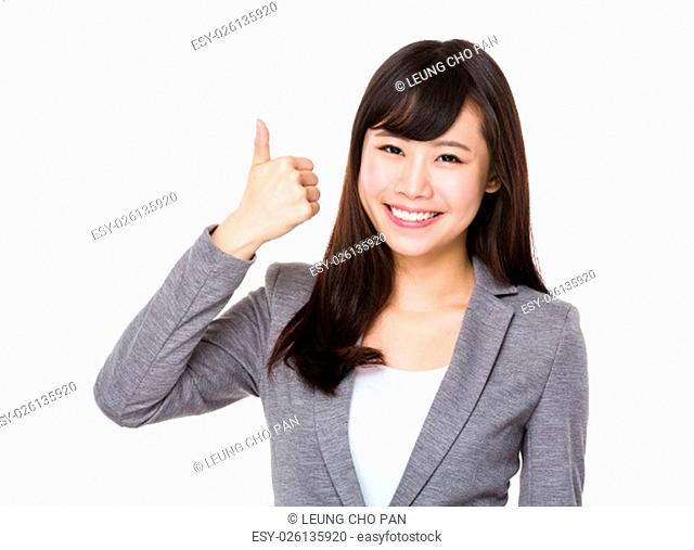Asian Young businesswoman showing htumb up gesture