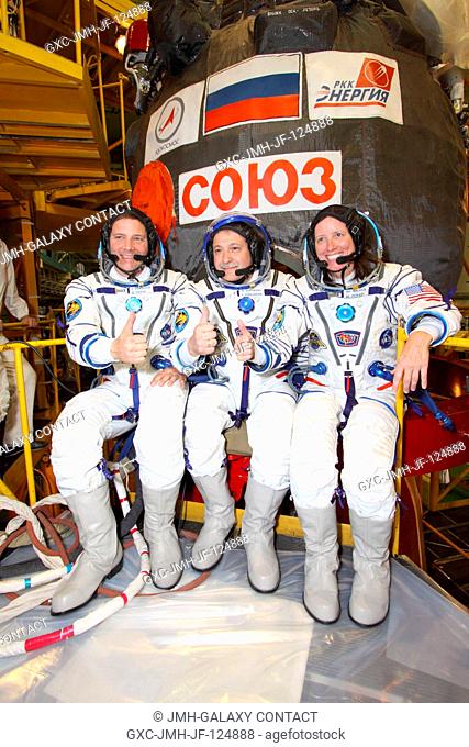 From left, NASA astronaut Doug Wheelock, Russian cosmonaut Fyodor Yurchikhin, and NASA astronaut Shannon Walker take a break from training and launch...