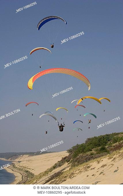Group of paragliders over the Bassin d'Arcachon, south of Bordeaux, France