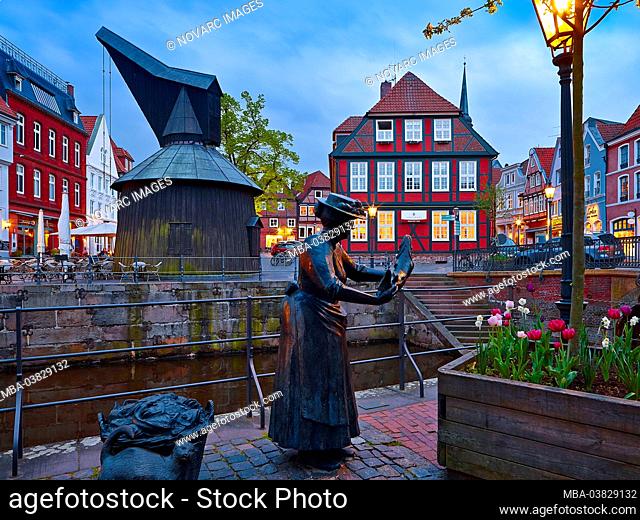 Plastic fish seller, wooden pedal crane and city scales at the old Hanseatic port of the Hanseatic city of Stade, Lower Saxony, Germany