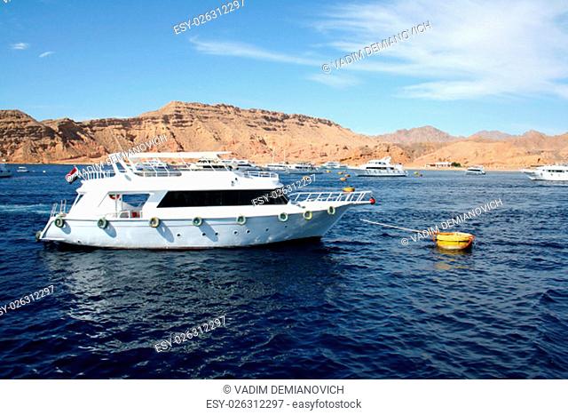 The powerboat in the Red Sea against small mountains of the Sinai Peninsula.