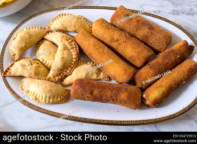 Sri Lankan rolls and samosas homemade filled with chickemn, curry and tuna