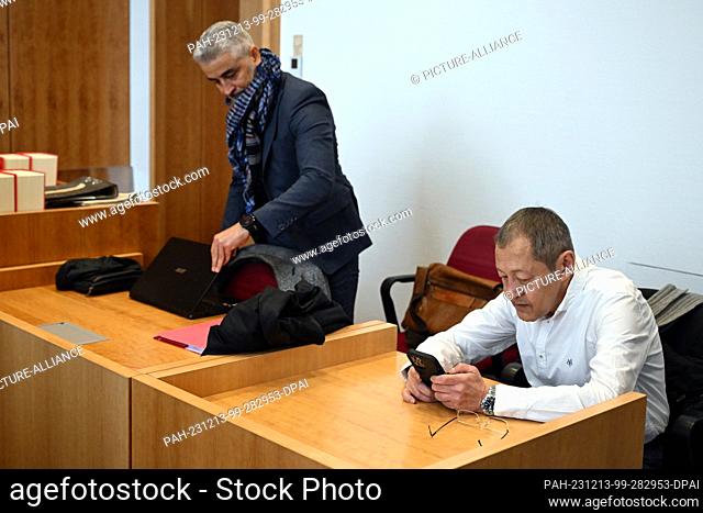 13 December 2023, North Rhine-Westphalia, Bonn: Author and blogger Akif Pirincci (r) and his lawyer Mustafa Kaplan wait in the courtroom of the district court...