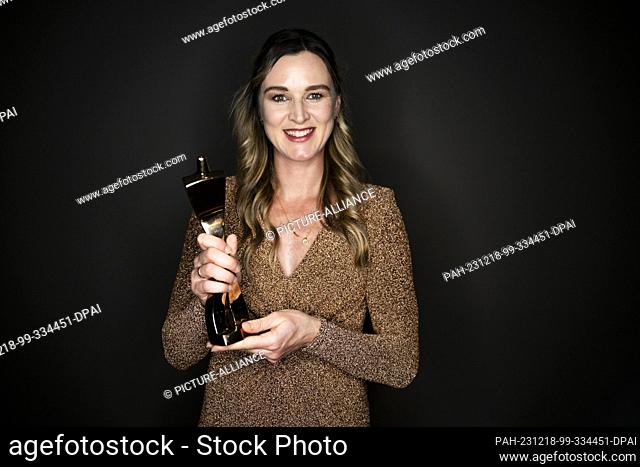 17 December 2023, Baden-Württemberg, Baden-Baden: Denise Herrmann-Wick poses with her trophy after receiving the ""Sportswoman of the Year 2023"" award