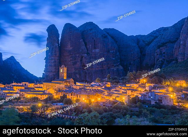 Landscape of the Mallos de Aguero by night famous geological formations with the town of Aguero in the province of Huesca Aragon, Spain