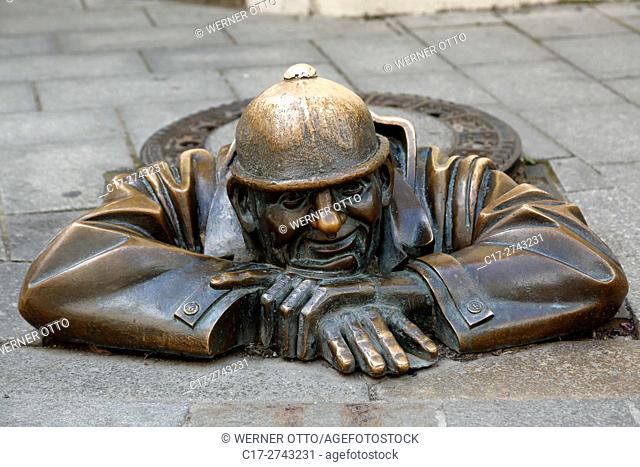 Slovak Republic, Slovakia, Bratislava, Capital City, Danube, Little Carpathians, Cumil, peepers, man looking out of a gully, manhole cover, sculpture
