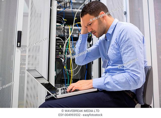 Technician becoming stressed over servers in data center