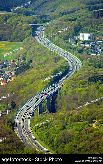 Aerial view of the freeway of the A45 motorway Sauerlandlinie with curves and bridges in the area Lüdenscheid-Nord with forest areas in Lüdenscheid in Sauerland...