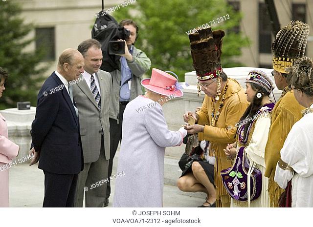 Her Majesty Queen Elizabeth II, Queen of England and the Duke of Edinburgh, Prince Philip receiving gift from Native American Indian Ceremony and Powhatan...