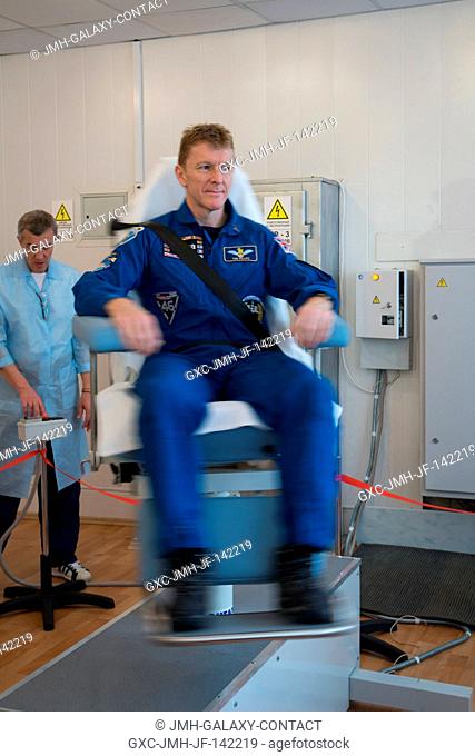 At the Cosmonaut Hotel crew quarters in Baikonur, Kazakhstan, Expedition 46-47 crewmember Tim Peake of the European Space Agency took a turn in a spinning chair...