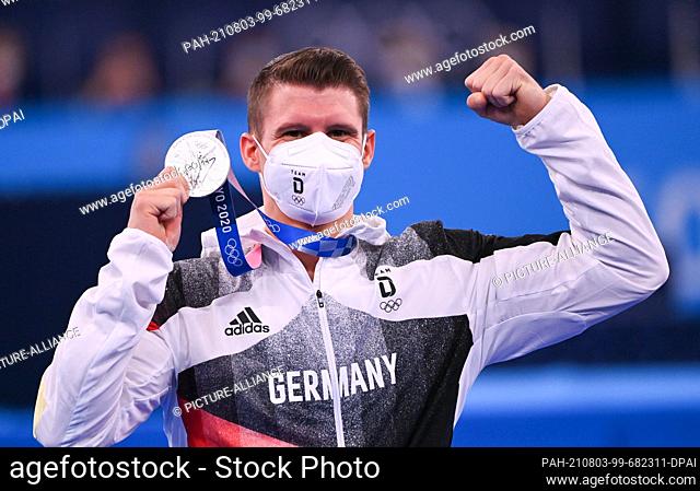 03 August 2021, Japan, Tokio: Gymnastics: Olympia, parallel bars, men, final at Ariake Gymnastics Centre. Lukas Dauser from Germany with silver medal at the...
