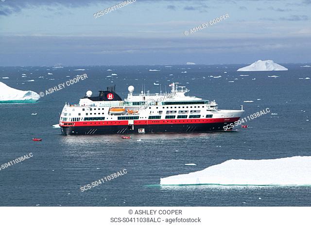 A cruise ship off Illulisat on Greenland Ilulissat is a UNESCO World Heritage Site because of the Jacobshavn Glacier or Sermeq Kujalleq which is the largest...