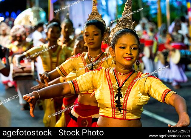 Sri Lanka, Colombo, Gangaramaya temple, the Nawam Maha Perahera festival, young women, dance group
