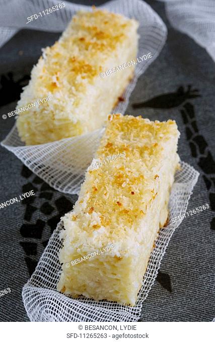 Two slices of coconut and cassava cake