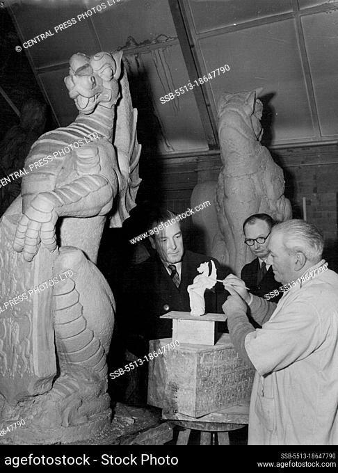 The Queen's Beasts For The Abbey Annexe - The sculptor, Mr. David Eccles, look at a scale model of the Dragon of the Tudors ( in foreground ) at the Hammersmith...