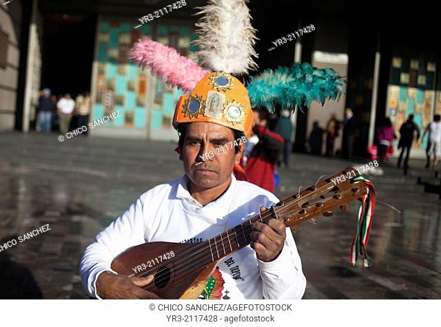 A conchero from Santiago Centro, Tamzle, San Luis Potosí, performs at the pilgrimage to Our Lady of Guadalupe Basilica in Mexico City, Mexico, December 10, 2013