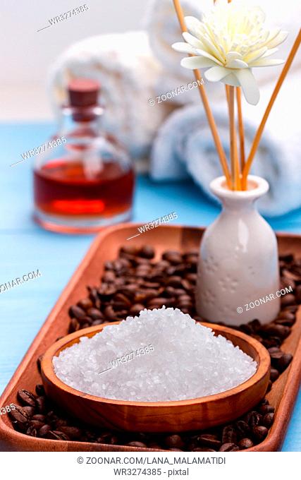 Bath salt and health care items. Spa setting on blue rustic background