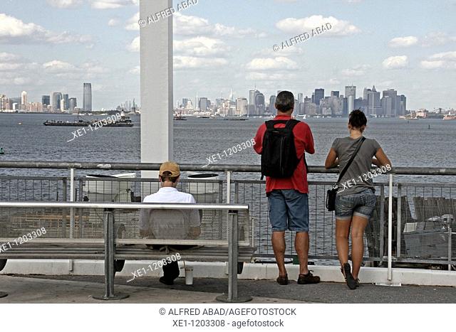 People watching Manhattan, Staten Island, New York, USA
