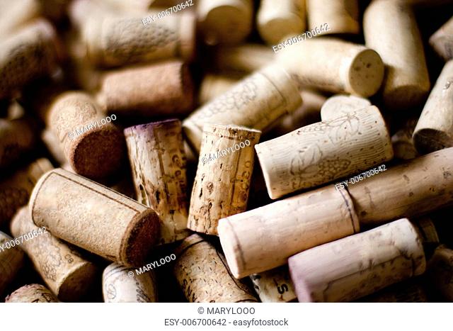 bunch of wine corks on wooden table