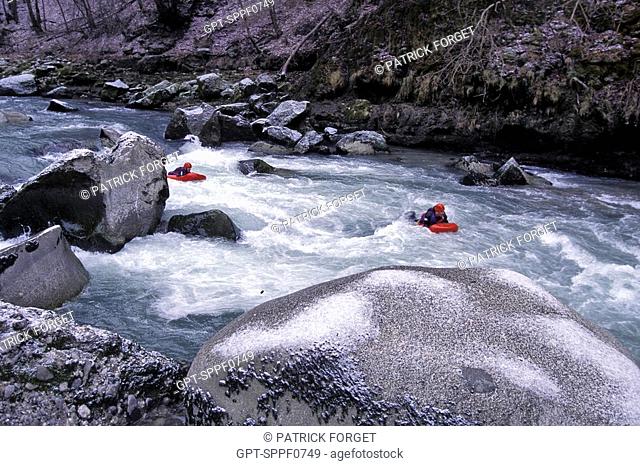 RESCUE WORKERS ON RIVER BOARDS ON THE RAPIDS OF THE DRANSE, HAUTE-SAVOIE 74, FRANCE