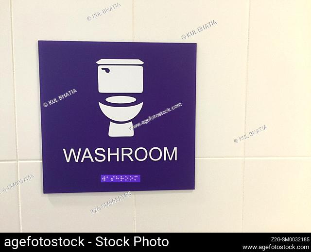 New, simplified bathroom signage - an image, a word, and Braille. Covers everyone. Universally understood