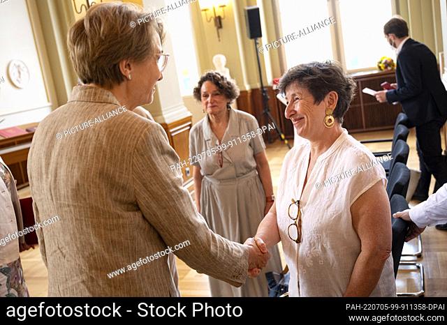 04 July 2022, Berlin: Nicole Levy (r) and Anne-Marie Descotes (l), Ambassador of France, attend the presentation of the Order of Merit of the State of Berlin to...