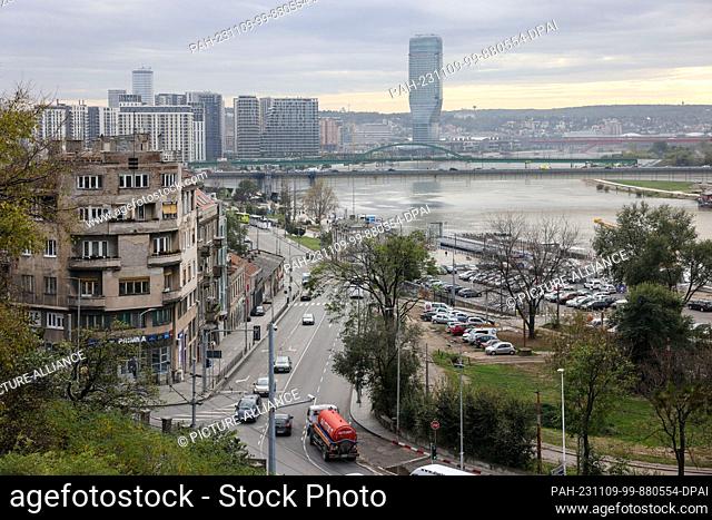 07 November 2023, Serbia, Belgrad: Residential buildings stand on the banks of the Sava in the Serbian capital. In the background are the new buildings of the...