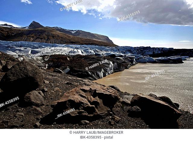 Glacial ice, glacier snout with traces of volcanic ash and glacial lake, glacier Svinafellsjökull in Skaftafell, Southern Region, Iceland