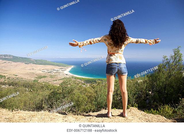 Woman over Bolonia beach at Cadiz Andalusia in Spain
