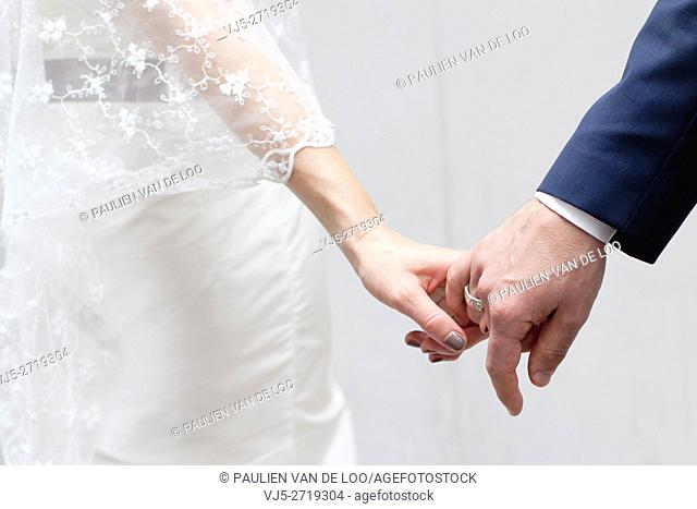 Helmond, Netherlands, a couple that is getting married is holding hands. They trust eachother