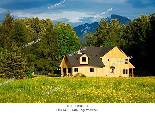 Under construction house in a field, Gold Bar, Stevens Pass Scenic Highway, Washington State, USA