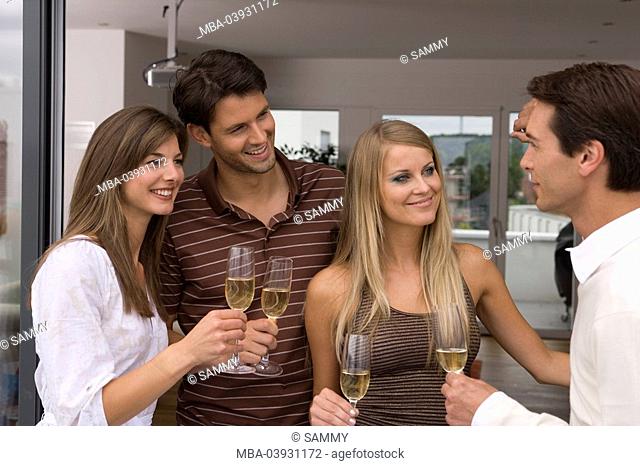 Group, smiling, holds, champagne-glasses, celebration, semi-portrait