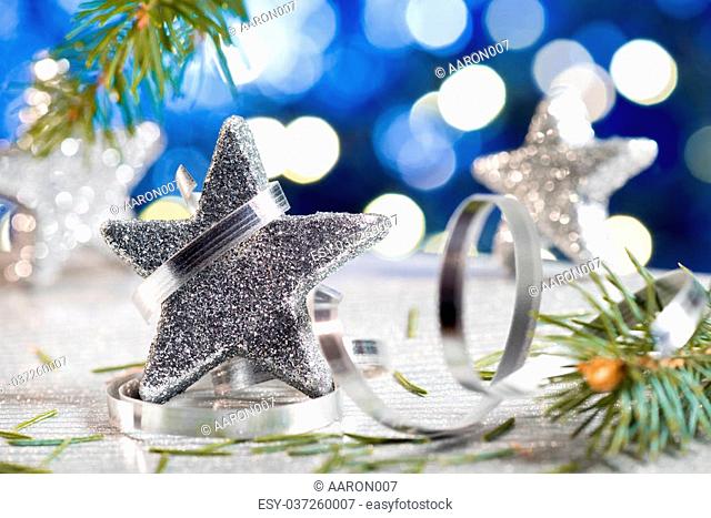 Silver Christmas star with needles and christmas decoration