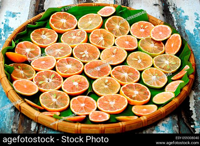 Group of pink lemon slices on wooden background, lemons is medicine for detox, treat to cough, sore throat, a healthy food, nature medicine that cheap
