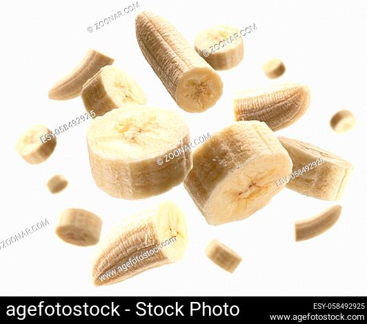 Pieces of peeled bananas levitate on a white background