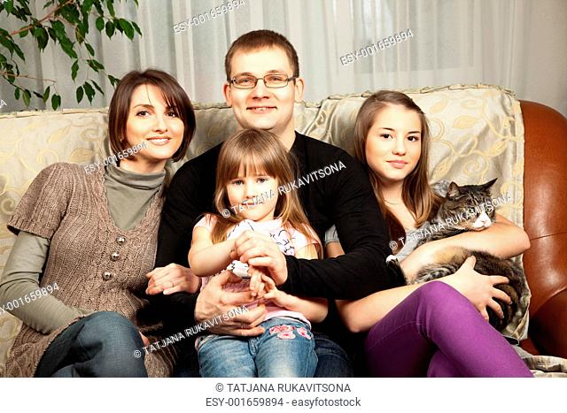 Cute Family In Their Sofa