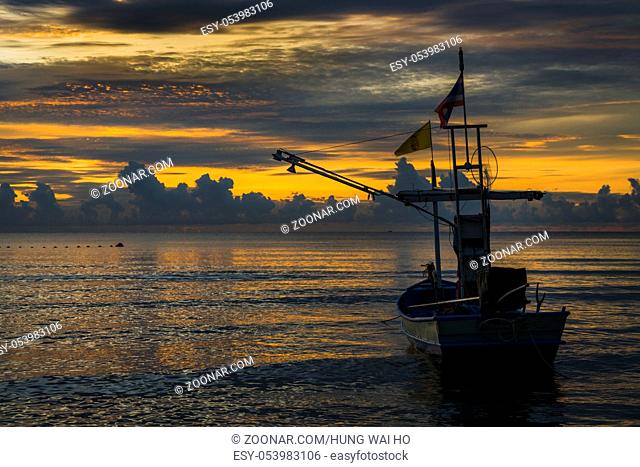 A fisherman boat in dawn