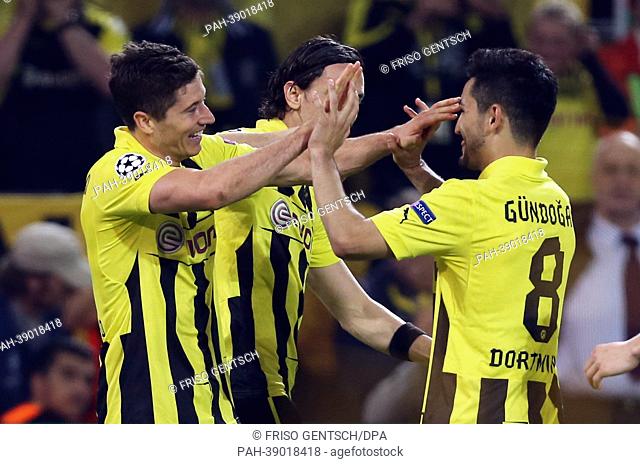 Dortmund's Robert Lewandowski (L-R) celebrates with Neven Subotic (hidden) and Ilkay Guendogan after scoring the 2-1 during the UEFA Champions League semi final...