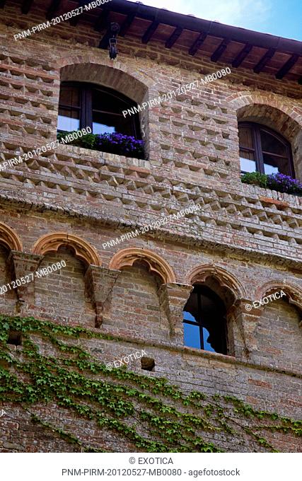 Low angle view of a hotel, Castello Delle Quattro Torra, Siena, Tuscany, Italy