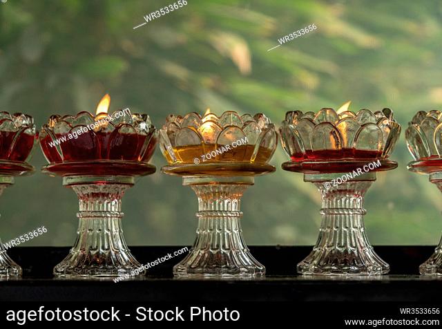 Colorful votive candles in glass dishes at Giant Wild Goose Pagoda in Xi'an