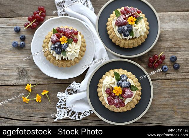 Vegan berry-and-almond tartlets with white chocolate-and-coconut cream