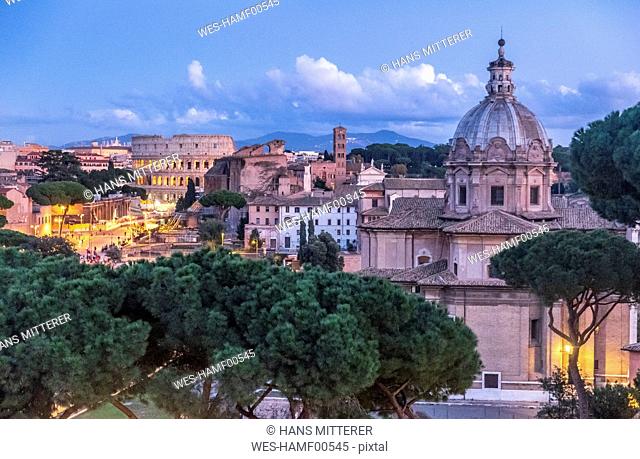 Italy, Rome, Chiesa di San Lorenzo in Miranda and Colosseum in the evening light