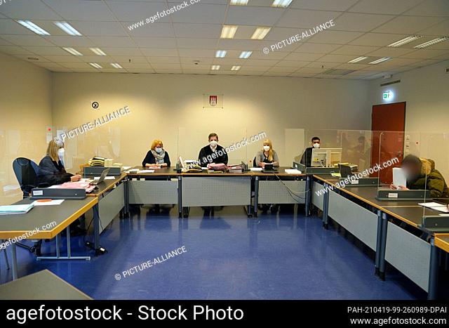 19 April 2021, Hamburg: A defendant (r) sits in the courtroom of St. Georg District Court at the beginning of the trial against him and an accomplice for joint...
