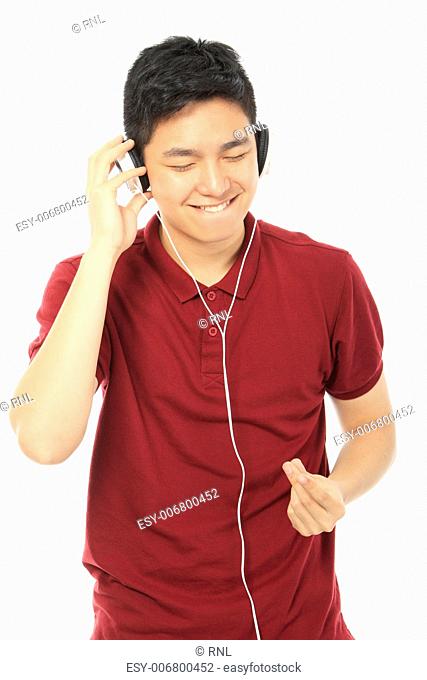A teenager wearing headphones and enjoying the music