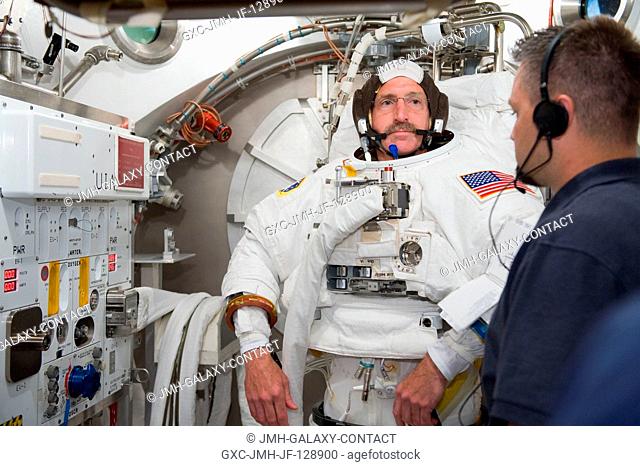 NASA astronaut Dan Burbank, Expedition 29 flight engineer and Expedition 30 commander, participates in an Extravehicular Mobility Unit (EMU) spacesuit fit check...