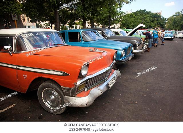 Old American cars used as taxi at the parking lot in Central Havana, Cuba, West Indies, Central America